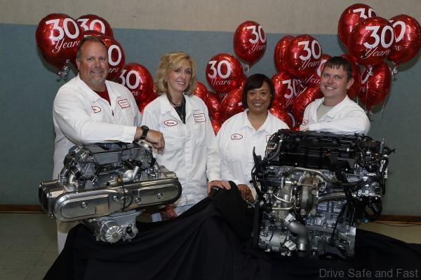 Anna Engine Plant Then and Now: Original team members John Homan and Brenda Meyer, Line 4 associates Kim Towsey and Shawn Priest with the plant's first GL1200 engine and the new turbo engine.