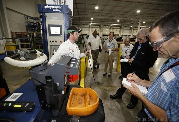 Mike Deter discusses the Hydrogen-powered Industrial Vehicles in use at the Marysville Auto Plant to journalists on Thursday's Green Path Tour.