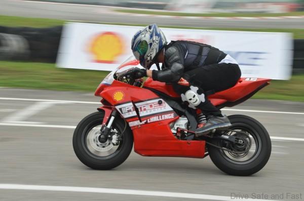 A Shell Advance contest winner doing a lap on the 150cc MiniGP bike at Elite Speedway Track in Shah Alam