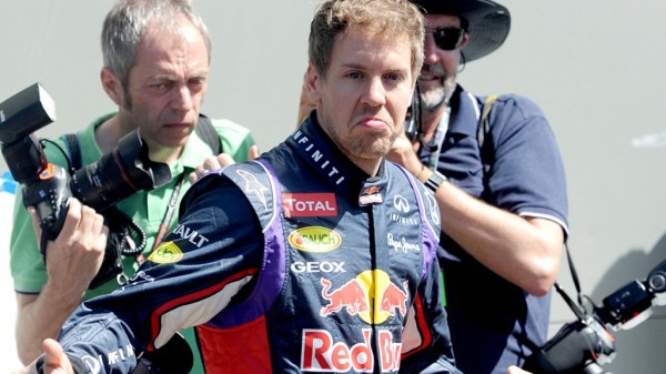 German Formula One driver Sebastian Vettel poses for the official portrait, at Albert Park race track in Melbourne, Thursday, March 13, 2014. The Australian Formula One Grand Prix will run this weekend. (AAP Image/Joe Castro) NO ARCHIVING