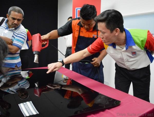 Mr. Lam Wai Keong, Assistant Tech Manager of Nippon Paint Malaysia demonstrating the self-healing properties of CyGLAZ technology