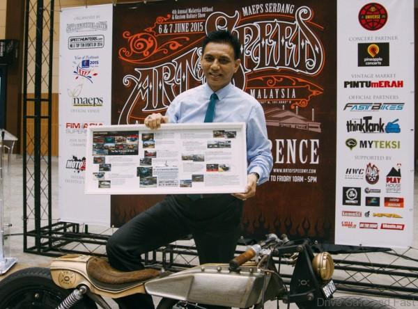 Zalizam Zakaria from Tourism Malaysia holding the article fro Speedhunter.com signed by Dato Seri Najib Razak