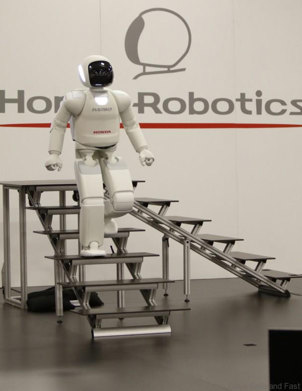 ASIMO climbs down the stairs at a recent demonstration in Marysville