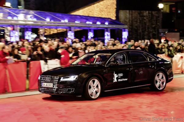 A piloted driving Audi A8 L W12 brings Daniel Brühl and his girlfriend Felicitas Rombold to the red carpet