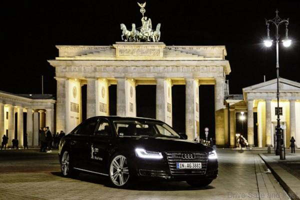 Piloted driving Audi A8 L W12 in front of the Brandenburg Gate