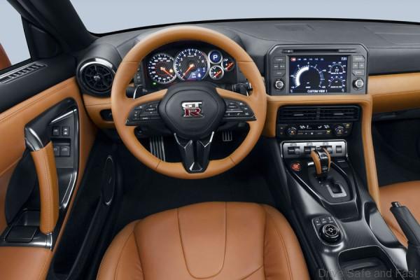 The 2017 GT-R's exterior receives a thorough makeover. The new "V-motion" grille, one of Nissan's latest design signatures, has been slightly enlarged to provide better engine cooling and now features a matte chrome finish and an updated mesh pattern. A new hood, featuring pronounced character lines flowing flawlessly from the grille, has been reinforced to enhance stability during high-speed driving. A freshly designed front spoiler lip and front bumpers with finishers situated immediately below the headlamps give the new GT-R the look of a pure-bred racecar, while generating high levels of front downforce.