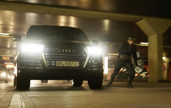 Captain America (Chris Evans) besides an Audi SQ7.