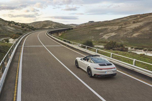 Porsche 911 GTS Targa in motion from the rear white