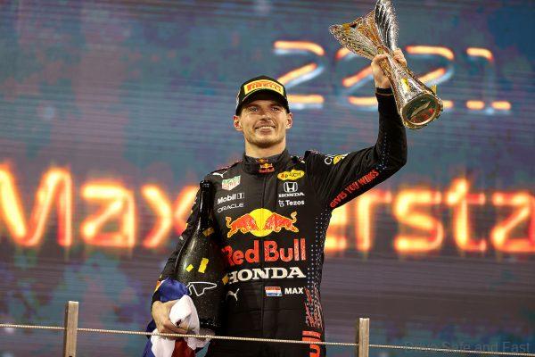 ABU DHABI, UNITED ARAB EMIRATES - DECEMBER 12: Race winner and 2021 F1 World Drivers Champion Max Verstappen of Netherlands and Red Bull Racing celebrates on the podium during the F1 Grand Prix of Abu Dhabi at Yas Marina Circuit on December 12, 2021 in Abu Dhabi, United Arab Emirates. (Photo by Lars Baron/Getty Images)