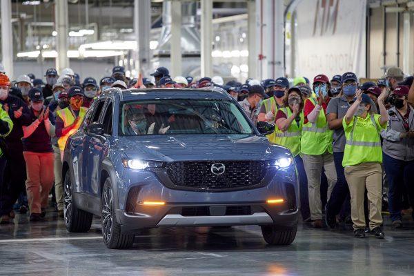 Employees celebrate at the Mazda Toyota Manufacturing Line-Off celebration for all-new 2023 Mazda CX-50 Crossover SUV on January 26, 2022, in Huntsville, ALA. (Jon Morgan/AP Images for Mazda North American Operations
