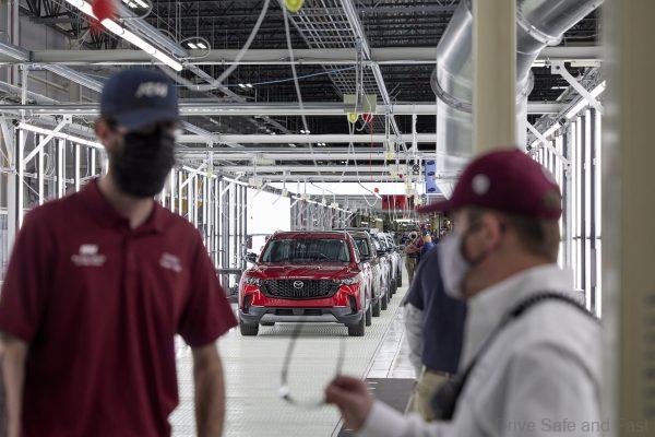 Employees celebrate at the Mazda Toyota Manufacturing Line-Off celebration for all-new 2023 Mazda CX-50 Crossover SUV on January 26, 2022, in Huntsville, ALA. (Jon Morgan/AP Images for Mazda North American Operations