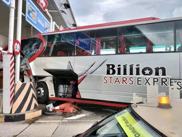 Four Injured After Bus Crashes Into Toll Booth Divider