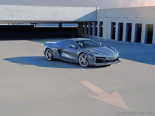 Passenger side front 3/4 view of 2024 Chevrolet Corvette E-Ray 3LZ coupe in Seawolf Gray parked in a parking garage. Pre-production model shown. Actual production model may vary. Model year 2024 Corvette E-Ray available 2023.