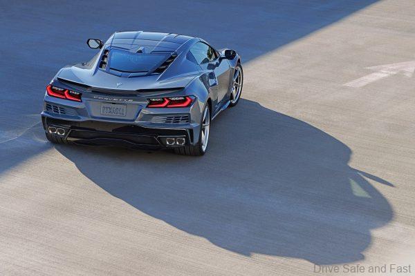 Rear 7/8 view of 2024 Chevrolet Corvette E-Ray 3LZ coupe in Seawolf Gray parked in a parking garage. Pre-production model shown. Actual production model may vary. Model year 2024 Corvette E-Ray available 2023.