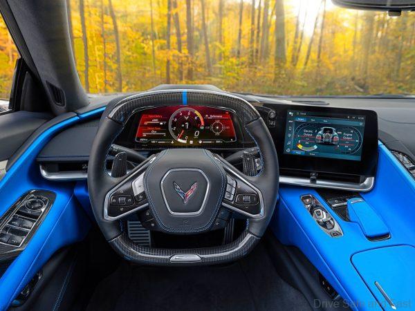 View from driver’s seat in 2024 Chevrolet Corvette E-Ray 3LZ coupe in Silver Flare with Two Tone Blue Interior. Pre-production model shown. Actual production model may vary. Model year 2024 Corvette E-Ray available 2023.