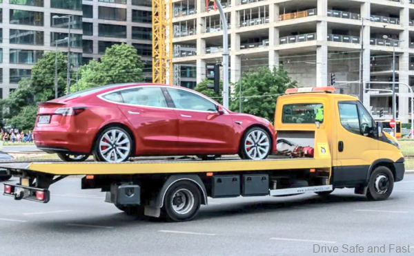 Electric car being towed