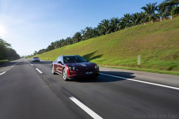 Porsche Taycan being driven across Malaysia