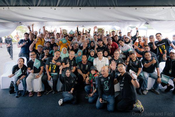 Lewis Hamilton in Malaysia posing with fans