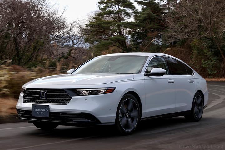 Honda Accord in White being driven