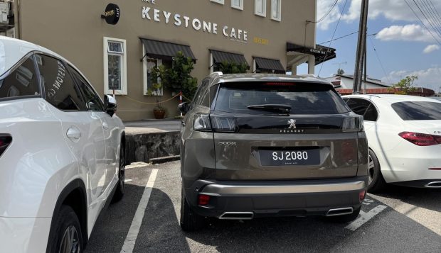 Keystone Cafe in Johor Bahru with the Peugeot 3008 parked in front
