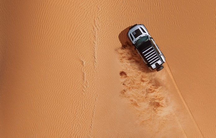 land rover defender in desert