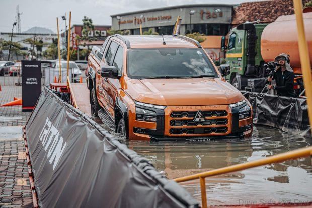 Mitsubishi Triton at an event doing water wading
