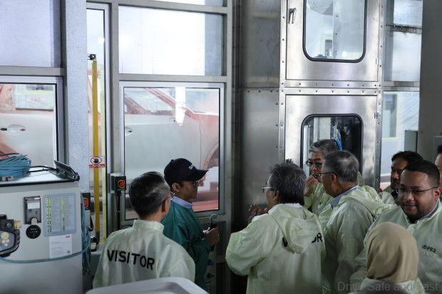 inokom has a new paint shop in Kulim and Datuk Johari Abdul Ghani looks through the glass and asks how much is that mazda in the window